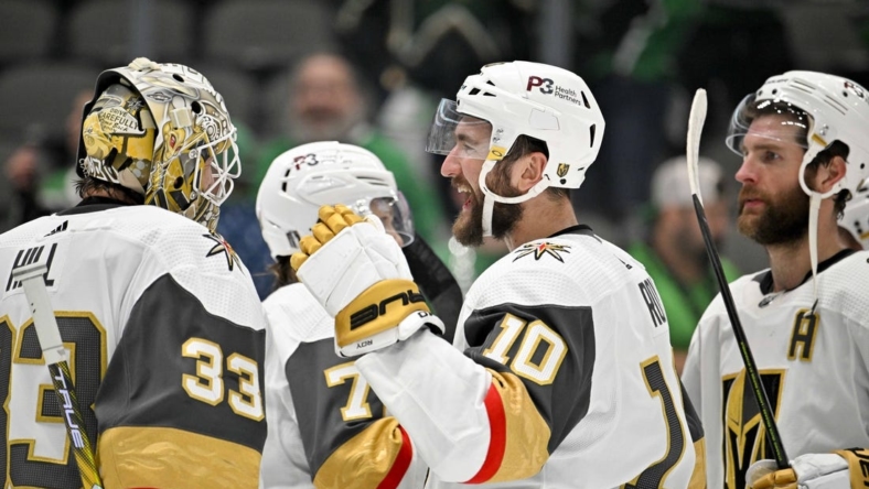 May 23, 2023; Dallas, Texas, USA; Vegas Golden Knights goaltender Adin Hill (33) and center Nicolas Roy (10) celebrate on the ice after the victory over the Dallas Stars in game three of the Western Conference Finals of the 2023 Stanley Cup Playoffs at American Airlines Center. Mandatory Credit: Jerome Miron-USA TODAY Sports