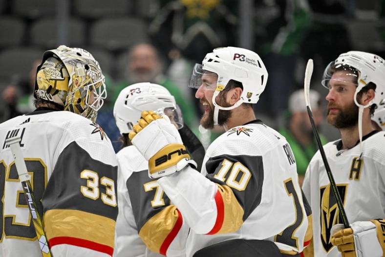 May 23, 2023; Dallas, Texas, USA; Vegas Golden Knights goaltender Adin Hill (33) and center Nicolas Roy (10) celebrate on the ice after the victory over the Dallas Stars in game three of the Western Conference Finals of the 2023 Stanley Cup Playoffs at American Airlines Center. Mandatory Credit: Jerome Miron-USA TODAY Sports
