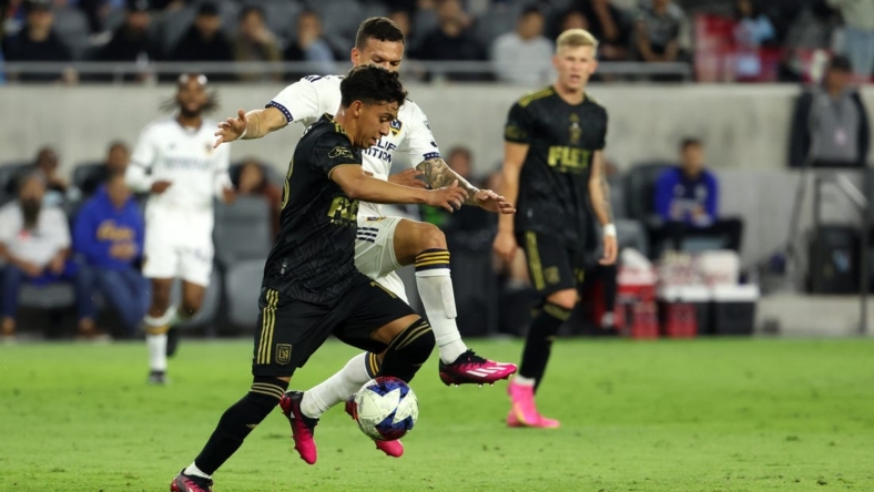 May 23, 2023; Los Angeles, CA, USA;  Los Angeles FC defender Erik Duenas (18) is fouled by Los Angeles Galaxy defender Calegari (2) during the first half of the the US Open Cup game at BMO Stadium. Mandatory Credit: Kiyoshi Mio-USA TODAY Sports