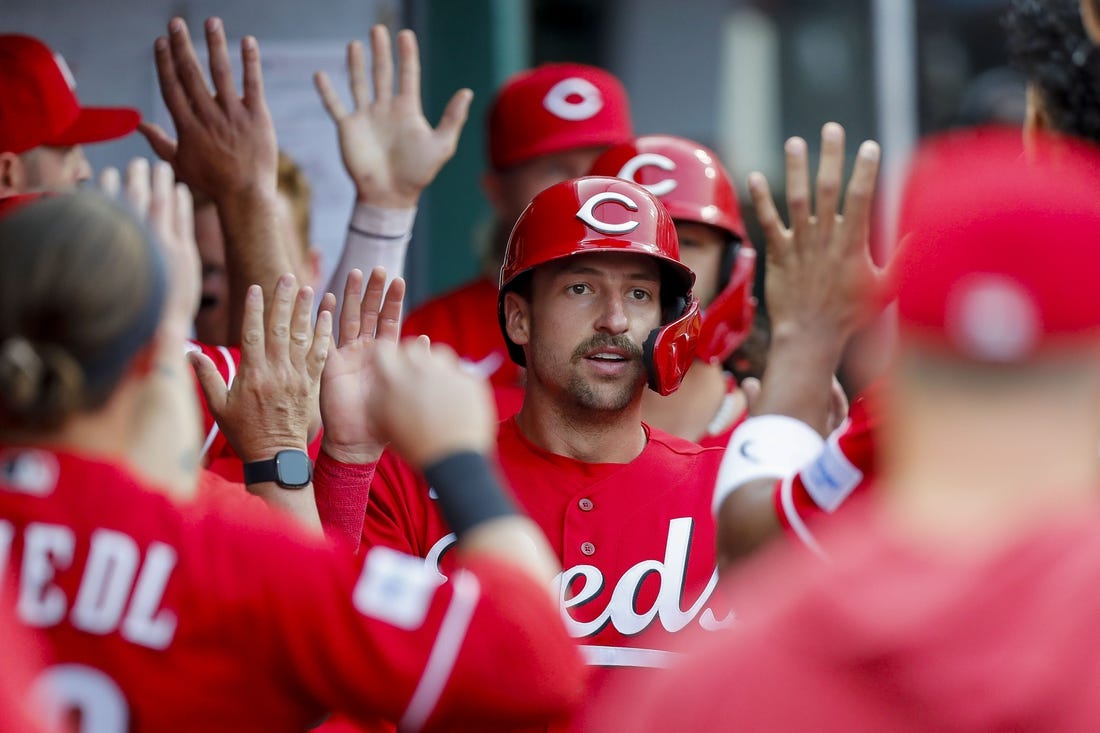 May 24, 2023; Cincinnati, Ohio, USA; Cincinnati Reds first baseman Spencer Steer (7) high fives teammates after scoring on a two-run single hit by catcher Tyler Stephenson (not pictured) in the first inning against the St. Louis Cardinals at Great American Ball Park. Mandatory Credit: Katie Stratman-USA TODAY Sports