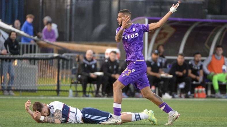 May 24, 2023; Langford, British Columbia, CAN;  Vancouver Whitecaps FC defender Tristan Blackmon (6) battles for the ball against Pacific FC forward Djenairo Daniels (23) during the second half at Starlight Stadium. Mandatory Credit: Anne-Marie Sorvin-USA TODAY Sports