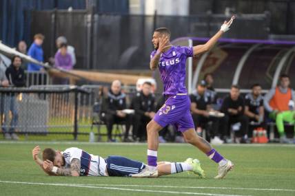 May 24, 2023; Langford, British Columbia, CAN;  Vancouver Whitecaps FC defender Tristan Blackmon (6) battles for the ball against Pacific FC forward Djenairo Daniels (23) during the second half at Starlight Stadium. Mandatory Credit: Anne-Marie Sorvin-USA TODAY Sports