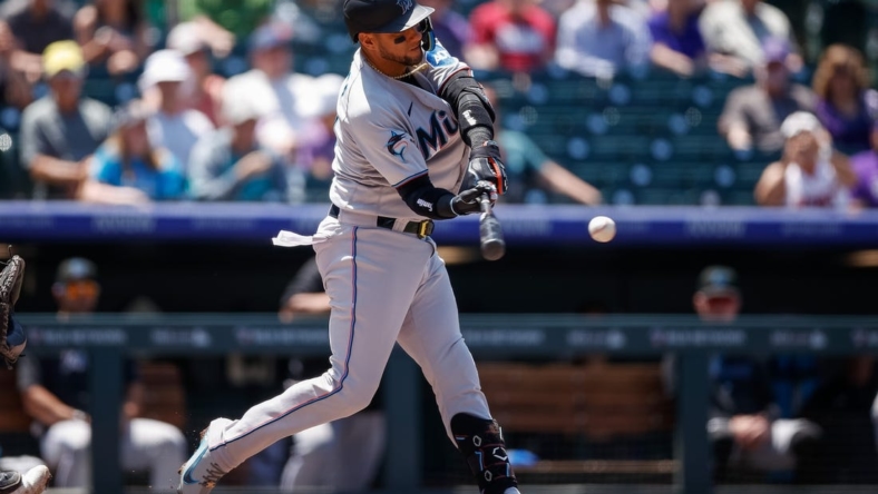 May 25, 2023; Denver, Colorado, USA; Miami Marlins first baseman Yuli Gurriel (10) this and RBI triple in the third inning against the Colorado Rockies at Coors Field. Mandatory Credit: Isaiah J. Downing-USA TODAY Sports