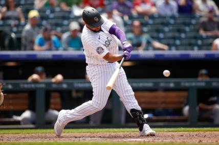 May 25, 2023; Denver, Colorado, USA; Colorado Rockies designated hitter Elias Diaz (35) hits a solo home run in the sixth inning against the Miami Marlins at Coors Field. Mandatory Credit: Isaiah J. Downing-USA TODAY Sports