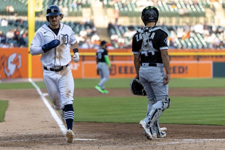 May 25, 2023; Detroit, Michigan, USA; Detroit Tigers second baseman Zach McKinstry (39) scores a run against the Chicago White Sox in the fourth inning at Comerica Park. Mandatory Credit: David Reginek-USA TODAY Sports