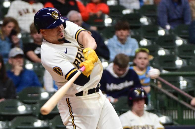 May 25, 2023; Milwaukee, Wisconsin, USA; Milwaukee Brewers shortstop Willy Adames (27) hits a double in the fourth inning against the San Francisco Giants at American Family Field. Mandatory Credit: Benny Sieu-USA TODAY Sports