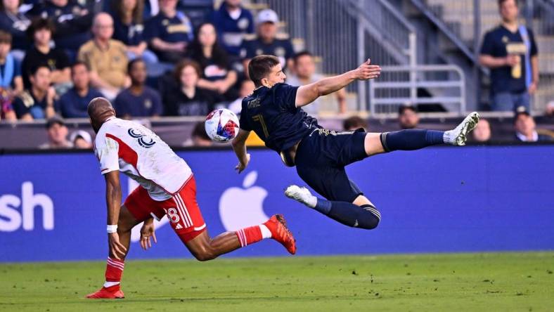 May 20, 2023; Philadelphia, Pennsylvania, USA; Philadelphia Union forward Mikkel Uhre (7) dives for the ball against New England Revolution defender Andrew Farrell (88) in the first half at Subaru Park. Mandatory Credit: Kyle Ross-USA TODAY Sports