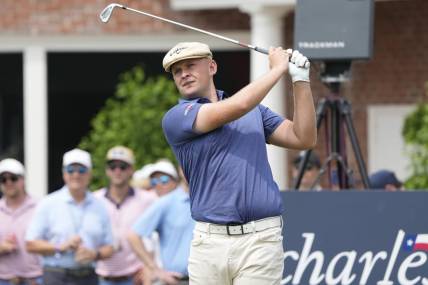 May 26, 2023; Fort Worth, Texas, USA; Harry Hall plays his shot from the 17th tee during the second round of the Charles Schwab Challenge golf tournament. Mandatory Credit: Jim Cowsert-USA TODAY Sports