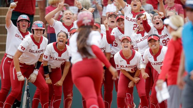 Oklahoma celebrates the home run of Oklahoma's Cydney Sanders (1) in the fourth inning during the NCAA Norman Super Regional softball game between the University of Oklahoma Sooners and the Clemson Tigers at Marita Hynes Field in Norman, Okla., Friday, May, 26, 2023.