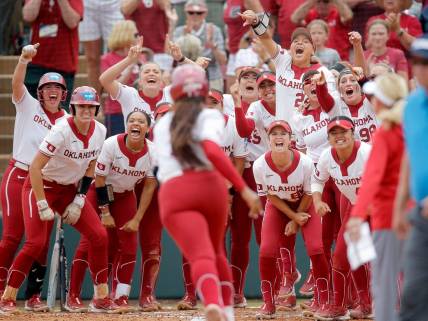 Oklahoma celebrates the home run of Oklahoma's Cydney Sanders (1) in the fourth inning during the NCAA Norman Super Regional softball game between the University of Oklahoma Sooners and the Clemson Tigers at Marita Hynes Field in Norman, Okla., Friday, May, 26, 2023.