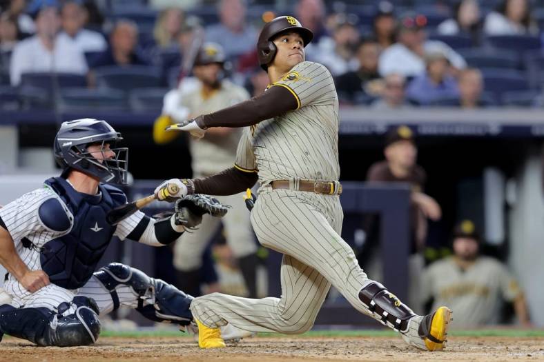 May 26, 2023; Bronx, New York, USA; San Diego Padres left fielder Juan Soto (22) follows through on a two run home run against the New York Yankees during the fifth inning at Yankee Stadium. Mandatory Credit: Brad Penner-USA TODAY Sports