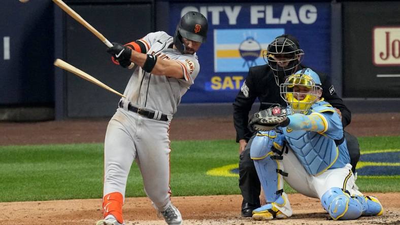 San Francisco Giants right fielder Michael Conforto (8) hits a broken bat single for an RBI during the sixth inning of their game against the Milwaukee Brewers Friday, May 26, 2023 at American Family Field in Milwaukee, Wis.
