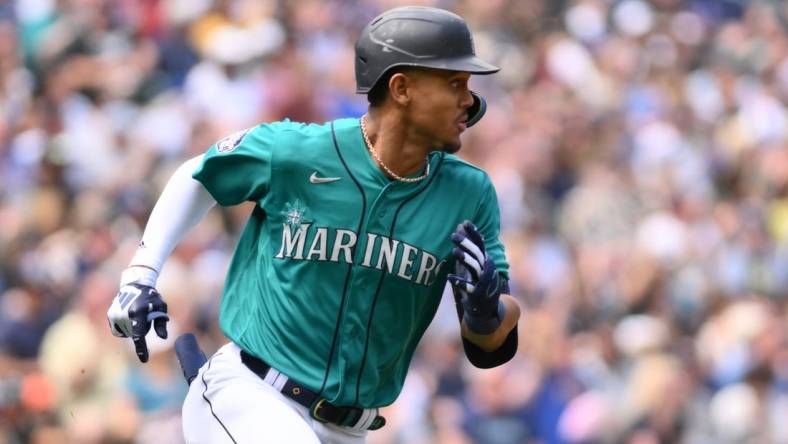 May 27, 2023; Seattle, Washington, USA; Seattle Mariners center fielder Julio Rodriguez (44) runs towards first base after hitting an RBI double against the Pittsburgh Pirates during the second inning at T-Mobile Park. Mandatory Credit: Steven Bisig-USA TODAY Sports