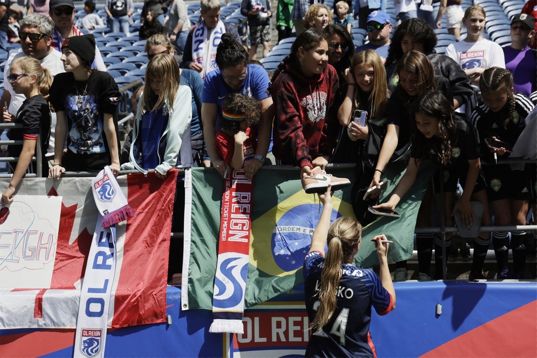 May 27, 2023; Seattle, Washington, USA; OL Reign forward Veronica Latsko (24) shakes hands with fans after the match against Angel City FC at Lumen Field. Mandatory Credit: John Froschauer-USA TODAY Sports