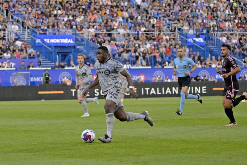 May 27, 2023; Montreal, Quebec, CAN; CF Montreal forward Sunusi Ibrahim (14) dribbles the ball against Inter Miami during the first half at Stade Saputo. Mandatory Credit: Eric Bolte-USA TODAY Sports