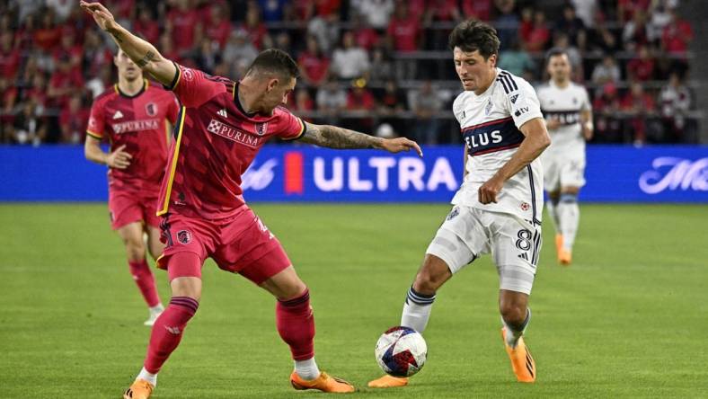 May 27, 2023; St. Louis, Missouri, USA; Vancouver Whitecaps midfielder Alessandro Schopf (8) dribbles the ball against St. Louis CITY SC defender Jake Nerwinski (2) during the first half at CITYPARK. Mandatory Credit: Scott Rovak-USA TODAY Sports