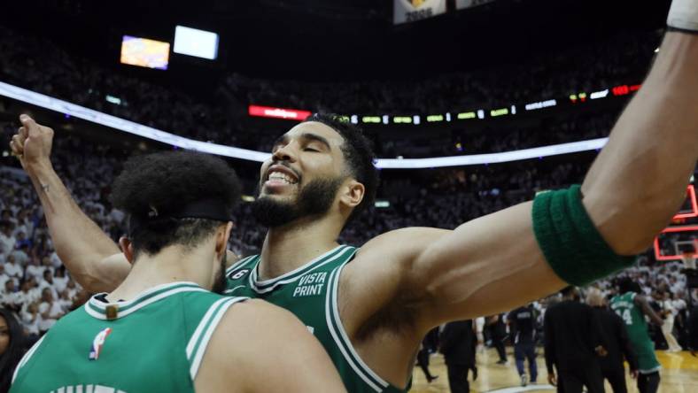 May 27, 2023; Miami, Florida, USA; Boston Celtics guard Derrick White (9) celebrates with forward Jayson Tatum (0) after defeating the Miami Heat in game six of the Eastern Conference Finals for the 2023 NBA playoffs at Kaseya Center. Mandatory Credit: Sam Navarro-USA TODAY Sports