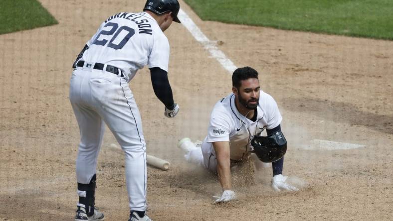 May 28, 2023; Detroit, Michigan, USA;  Detroit Tigers center fielder Riley Greene (31) slides in safe at home in the eighth inning against the Chicago White Sox at Comerica Park. Mandatory Credit: Rick Osentoski-USA TODAY Sports