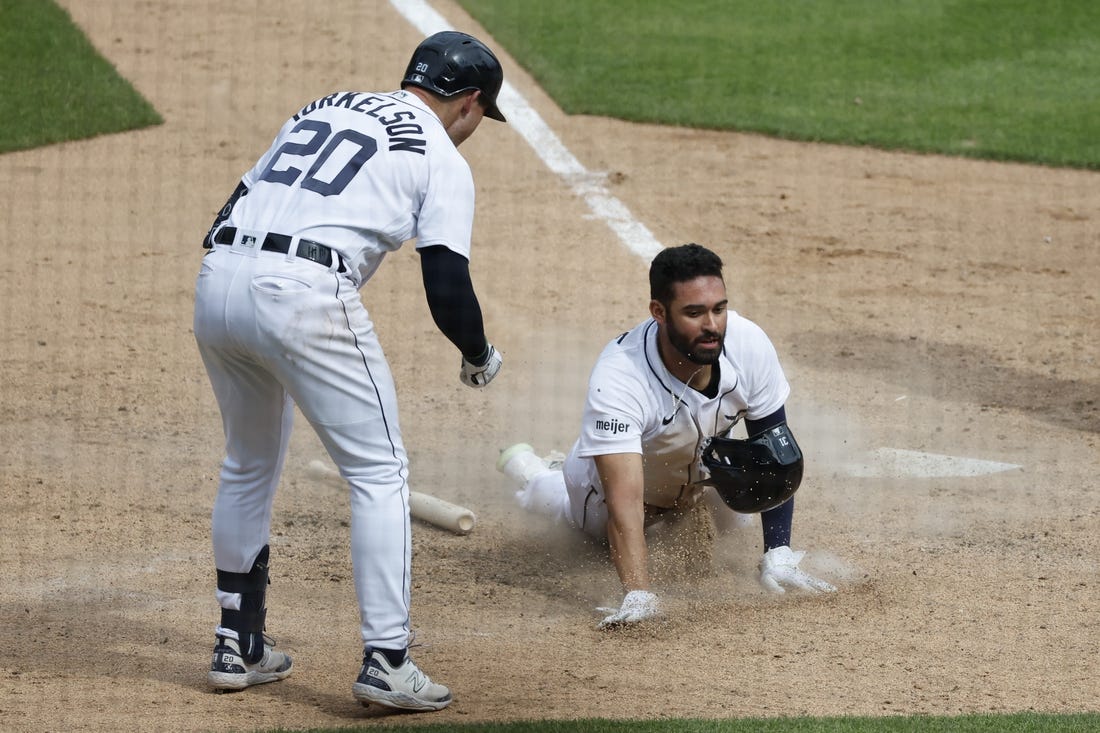 May 28, 2023; Detroit, Michigan, USA;  Detroit Tigers center fielder Riley Greene (31) slides in safe at home in the eighth inning against the Chicago White Sox at Comerica Park. Mandatory Credit: Rick Osentoski-USA TODAY Sports