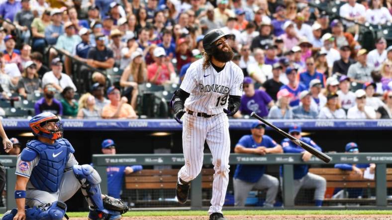 May 28, 2023; Denver, Colorado, USA; Colorado Rockies designated hitter Charlie Blackmon (19) hits a 374 ft home run in the fifth inning against the New York Mets at Coors Field. Mandatory Credit: John Leyba-USA TODAY Sports