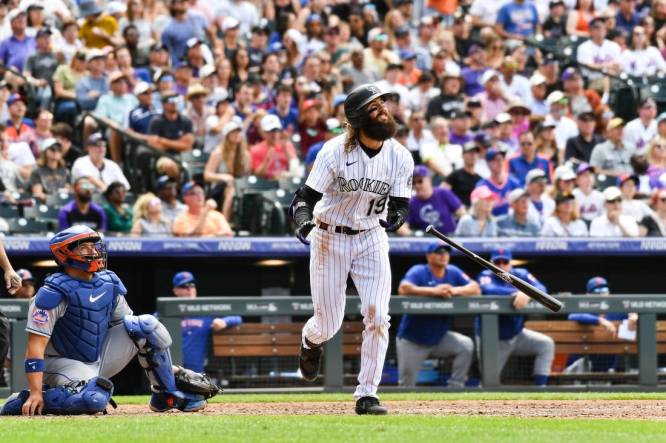 May 28, 2023; Denver, Colorado, USA; Colorado Rockies designated hitter Charlie Blackmon (19) hits a 374 ft home run in the fifth inning against the New York Mets at Coors Field. Mandatory Credit: John Leyba-USA TODAY Sports