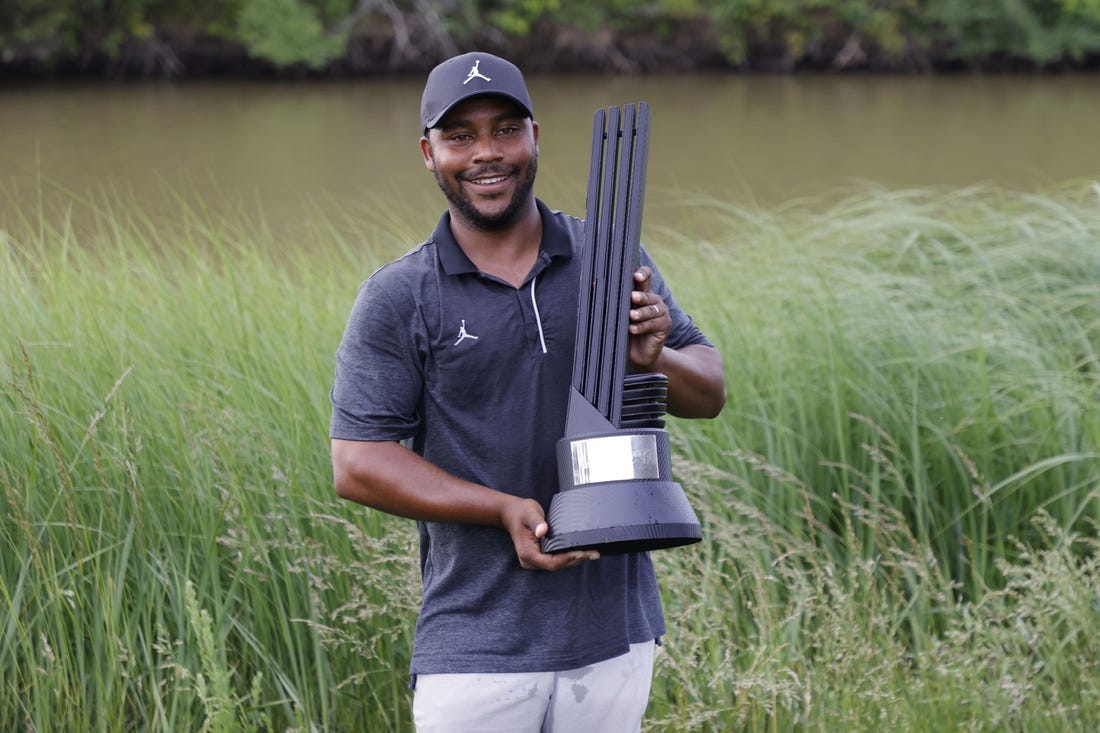 May 28, 2023; Potomac Falls, Virginia, USA; Harold Varner III poses with the champions trophy after winning the individual championship of LIV Golf Washington, D.C. golf tournament at Trump National. Mandatory Credit: Geoff Burke-USA TODAY Sports