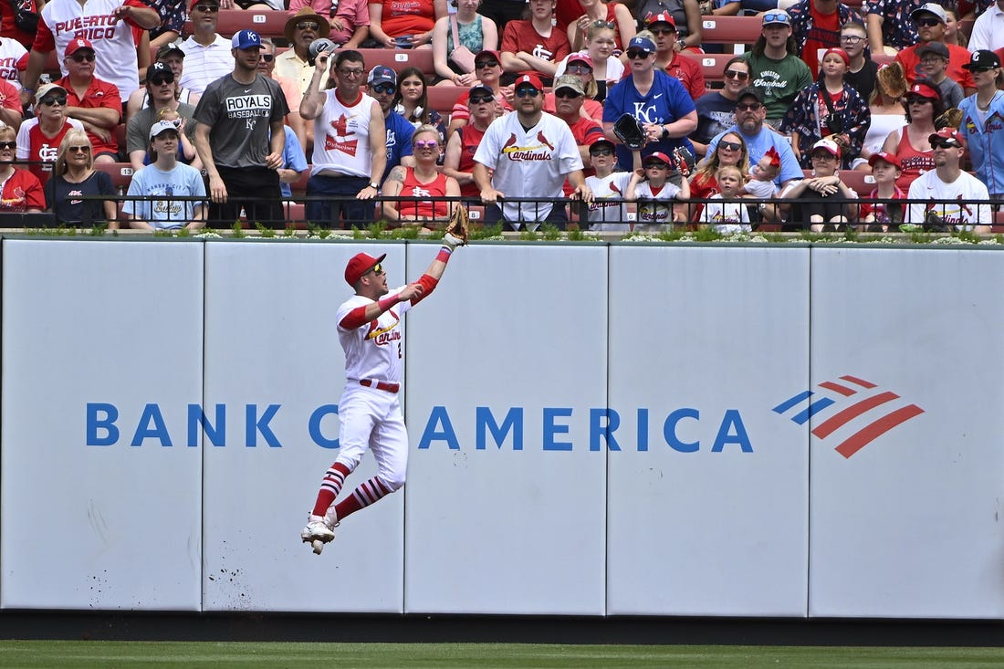 May 29, 2023; St. Louis, Missouri, USA;  St. Louis Cardinals center fielder Lars Nootbaar (21) leaps at the wall and catches a fly ball hit by Kansas City Royals second baseman Michael Massey (not pictured) during the second inning at Busch Stadium. Mandatory Credit: Jeff Curry-USA TODAY Sports