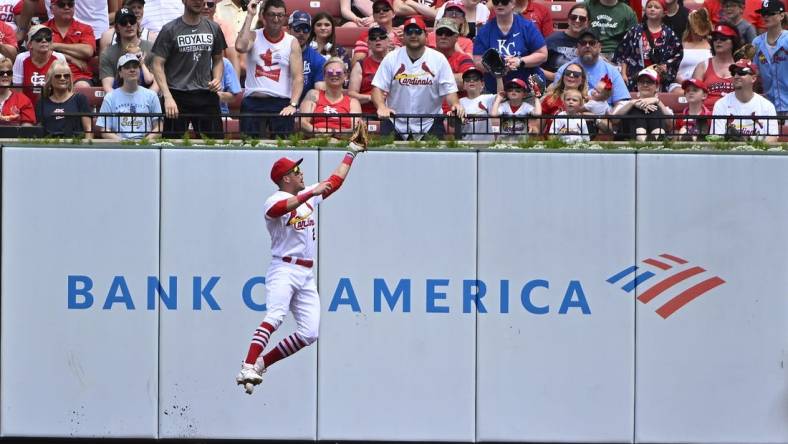 May 29, 2023; St. Louis, Missouri, USA;  St. Louis Cardinals center fielder Lars Nootbaar (21) leaps at the wall and catches a fly ball hit by Kansas City Royals second baseman Michael Massey (not pictured) during the second inning at Busch Stadium. Mandatory Credit: Jeff Curry-USA TODAY Sports