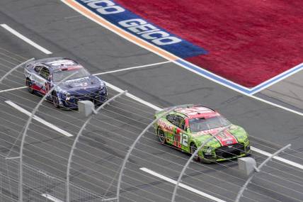 May 29, 2023; Concord, North Carolina, USA; NASCAR Cup Series driver Ryan Blaney (12) takes the lead from driver William Byron (24) during the Coca-Cola 600 at Charlotte Motor Speedway. Mandatory Credit: Jim Dedmon-USA TODAY Sports