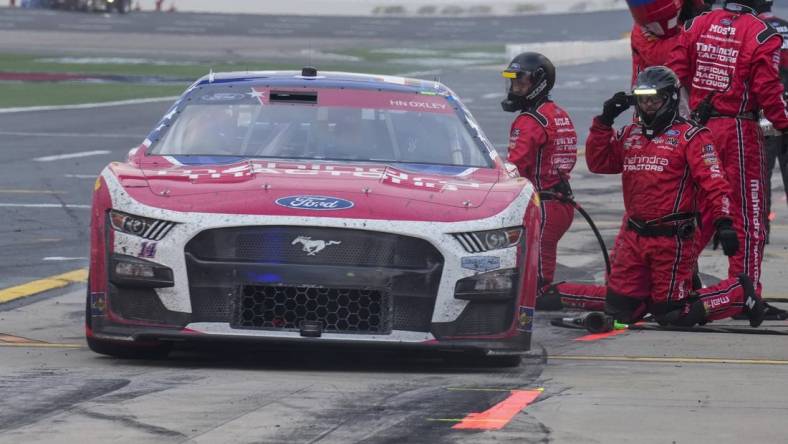 May 29, 2023; Concord, North Carolina, USA; NASCAR Cup Series driver Chase Briscoe (14) leaves his pits after a stop during the Coca-Cola 600 at Charlotte Motor Speedway. Mandatory Credit: Jim Dedmon-USA TODAY Sports