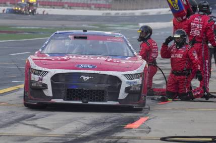 May 29, 2023; Concord, North Carolina, USA; NASCAR Cup Series driver Chase Briscoe (14) leaves his pits after a stop during the Coca-Cola 600 at Charlotte Motor Speedway. Mandatory Credit: Jim Dedmon-USA TODAY Sports