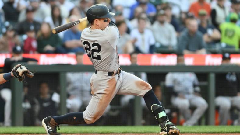 May 29, 2023; Seattle, Washington, USA; New York Yankees center fielder Harrison Bader (22) hits a single against the Seattle Mariners during the third inning at T-Mobile Park. Mandatory Credit: Steven Bisig-USA TODAY Sports