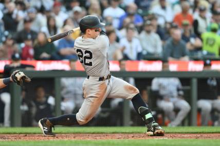 May 29, 2023; Seattle, Washington, USA; New York Yankees center fielder Harrison Bader (22) hits a single against the Seattle Mariners during the third inning at T-Mobile Park. Mandatory Credit: Steven Bisig-USA TODAY Sports