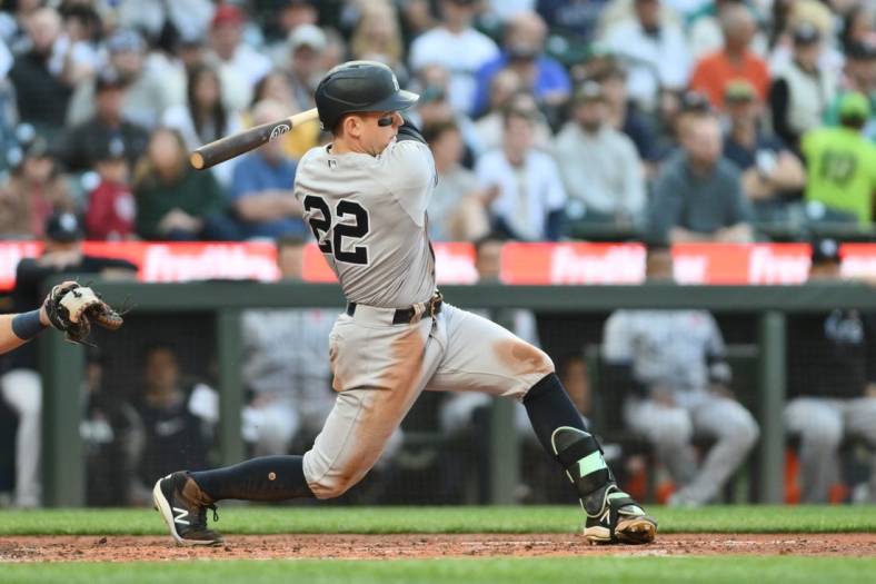 May 29, 2023; Seattle, Washington, USA; New York Yankees center fielder Harrison Bader (22) hits a single against the Seattle Mariners during the third inning at T-Mobile Park. Mandatory Credit: Steven Bisig-USA TODAY Sports
