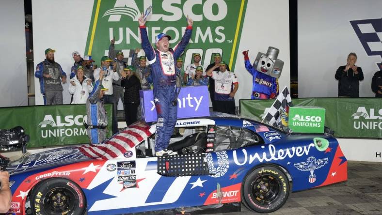 May 29, 2023; Concord, North Carolina, USA; NASCAR Xfinity Series driver Justin Allgaier (7) celebrates his win during the Alsco Uniforms 300 at Charlotte Motor Speedway. Mandatory Credit: Jim Dedmon-USA TODAY Sports