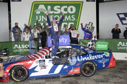 May 29, 2023; Concord, North Carolina, USA; NASCAR Xfinity Series driver Justin Allgaier (7) celebrates his win during the Alsco Uniforms 300 at Charlotte Motor Speedway. Mandatory Credit: Jim Dedmon-USA TODAY Sports