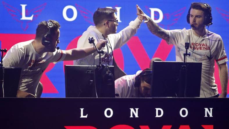 Jan 25, 2020; Minneapolis, Minnesota, USA; Matthew Skrapz Marshall and Dylan Henderson and Rhys Rated Price of the London Royal Ravens celebrate after defeating the New York Subliners during the Call of Duty League Launch Weekend at The Armory. Mandatory Credit: Bruce Kluckhohn-USA TODAY Sports