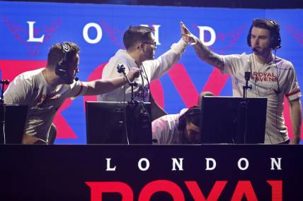 Jan 25, 2020; Minneapolis, Minnesota, USA; Matthew Skrapz Marshall and Dylan Henderson and Rhys Rated Price of the London Royal Ravens celebrate after defeating the New York Subliners during the Call of Duty League Launch Weekend at The Armory. Mandatory Credit: Bruce Kluckhohn-USA TODAY Sports