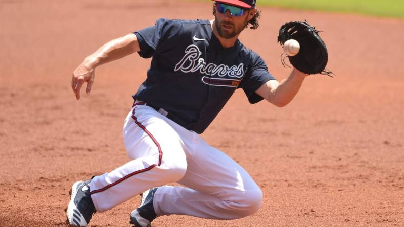 Jul 16, 2020; Atlanta, Georgia, United States;  Atlanta Braves second baseman Charlie Culberson (8) fields a ground ball during an intrasquad game in their summer workout session at Truist Park. Mandatory Credit: John David Mercer-USA TODAY Sports