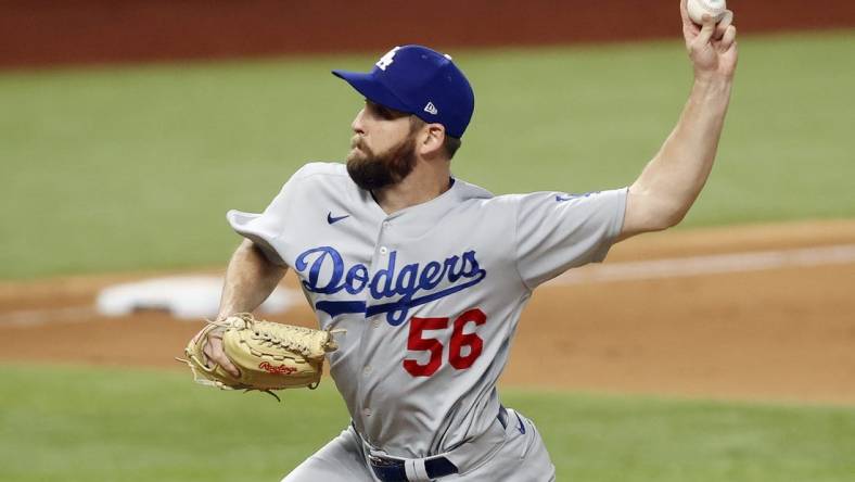 Oct 14, 2020; Arlington, Texas, USA; Los Angeles Dodgers relief pitcher Adam Kolarek (56) throws against the Atlanta Braves during the ninth inning of game three of the 2020 NLCS at Globe Life Field. Mandatory Credit: Tim Heitman-USA TODAY Sports