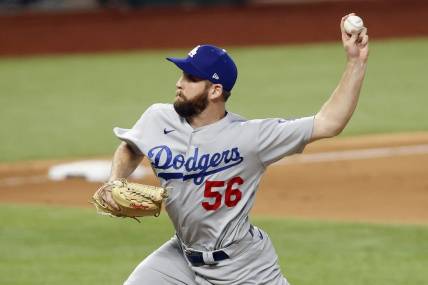 Oct 14, 2020; Arlington, Texas, USA; Los Angeles Dodgers relief pitcher Adam Kolarek (56) throws against the Atlanta Braves during the ninth inning of game three of the 2020 NLCS at Globe Life Field. Mandatory Credit: Tim Heitman-USA TODAY Sports