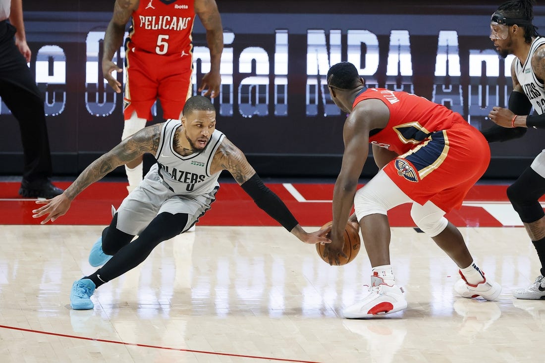 Trade chatter before Thursday's NBA draft connects Portland Trail Blazers point guard Damian Lillard (left) with New Orleans Pelicans power forward Zion Williamson. Mandatory Credit: Soobum Im-USA TODAY Sports