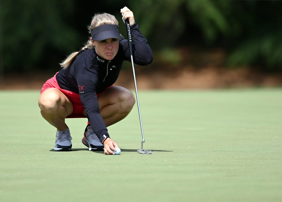 Jun 24, 2021; John's Creek, Georgia, USA; Dani Holmqvist lines up a putt on the sixth green during the first round of the KPMG Women's PGA Championship golf tournament at the Atlanta Athletic Club. Mandatory Credit: Adam Hagy-USA TODAY Sports