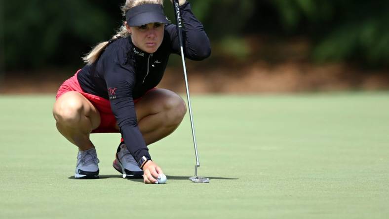 Jun 24, 2021; John's Creek, Georgia, USA; Dani Holmqvist lines up a putt on the sixth green during the first round of the KPMG Women's PGA Championship golf tournament at the Atlanta Athletic Club. Mandatory Credit: Adam Hagy-USA TODAY Sports