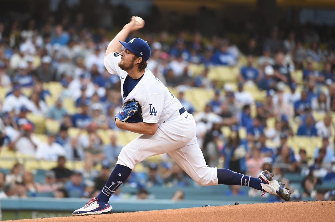 Jun 28, 2021; Los Angeles, California, USA;  Los Angeles Dodgers starting pitcher Trevor Bauer (27) pitches against the San Francisco Giants in the first inning at Dodger Stadium. Mandatory Credit: Richard Mackson-USA TODAY Sports