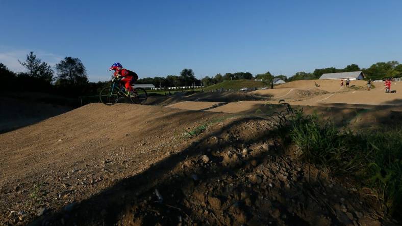 Ryder Osowski of Westerville takes a warm-up lap around the course during the weekly organized racing at the new Westerville BMX course at Alum Creek South Park on Tuesday, Sept. 7, 2021. The 1,000-foot track just opened for racing at the beginning of August.

Westerville Bmx