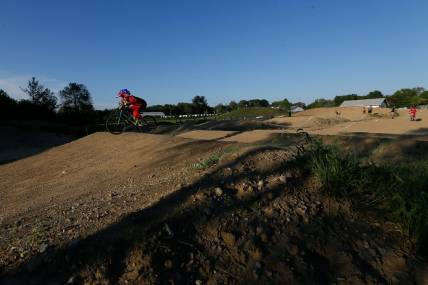 Ryder Osowski of Westerville takes a warm-up lap around the course during the weekly organized racing at the new Westerville BMX course at Alum Creek South Park on Tuesday, Sept. 7, 2021. The 1,000-foot track just opened for racing at the beginning of August.

Westerville Bmx