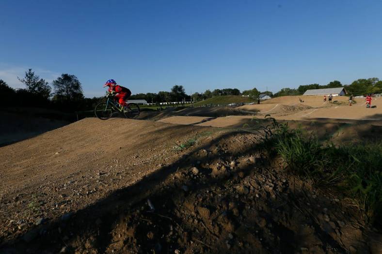 Ryder Osowski of Westerville takes a warm-up lap around the course during the weekly organized racing at the new Westerville BMX course at Alum Creek South Park on Tuesday, Sept. 7, 2021. The 1,000-foot track just opened for racing at the beginning of August.

Westerville Bmx