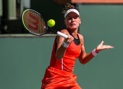 Veronika Kudermetova of Russia returns the ball while playing with doubles partner Elena Rybakina of Kazakhstan against Su-Wei Hsieh of Taiwan and Elise Mertens of Belgium during the women's doubles final of the BNP Paribas Open at the Indian Wells Tennis Garden, Saturday, Oct. 16, 2021, in Indian Wells, Calif.
