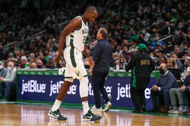 Dec 13, 2021; Boston, Massachusetts, USA; Milwaukee Bucks forward Khris Middleton (22) walks off the court after injuring his knee during the second half against the Boston Celtics at TD Garden. Mandatory Credit: Paul Rutherford-USA TODAY Sports